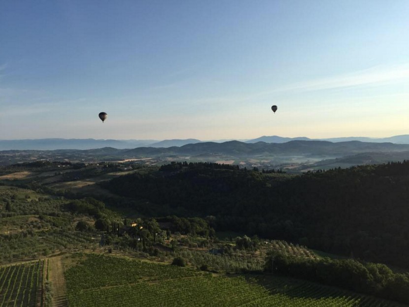 Hot air balloons flying over Tuscany