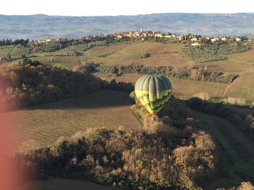 golden hot air balloon in flight