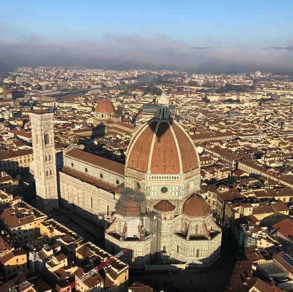 View of the city on de Balloon Shadow of a hot air balloon over the cathedral